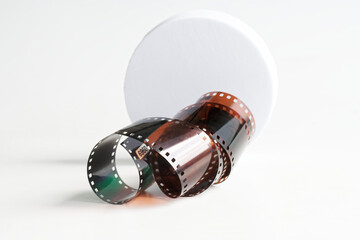 Studio numbered developed photographic film on white background. Retro and futurism. Past in the future. Memory and nostalgia. Photo