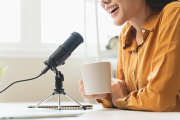 Close-up microphone on the table in podcasting record.