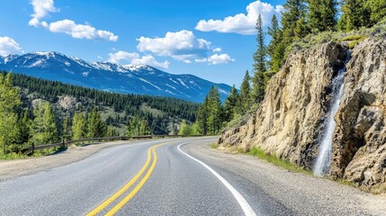 Fototapeta premium Scenic Mountain Road with Waterfall and Clear Sky
