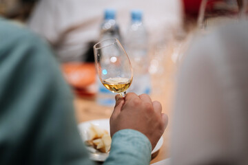 Elegant whiskey tasting experience, showcasing premium golden whiskey in a glass, refined events