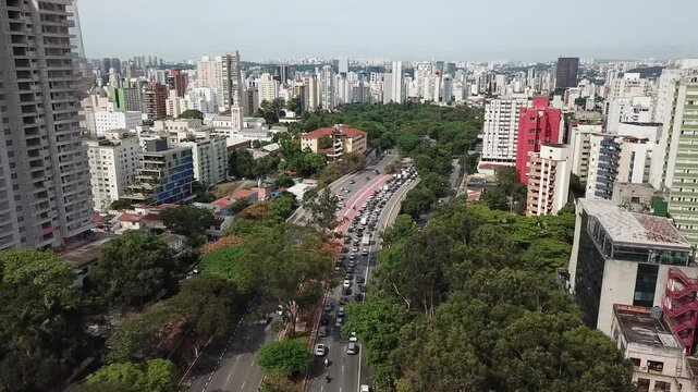 Aerial shot over Sumare Avenue with a view of traffic and buildings in S&atilde;o Paulo