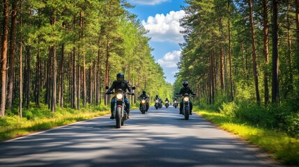 Obraz premium A group of motorbikes on the forest road riding. having fun driving the empty road on a motorcycle tour journey. In summer against a blue sky. front view