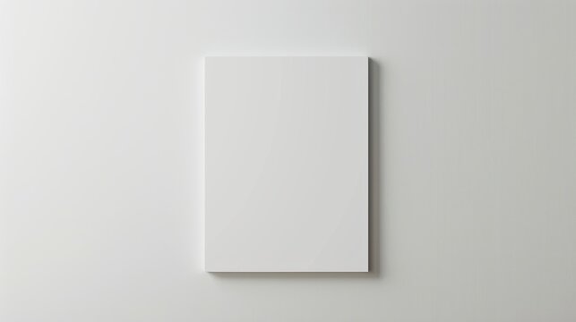 Blank white canvas hanging on a white wall. Minimalist design template for art and posters.