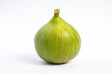 Obraz premium A single green fig sitting on top of a clean white surface, ready for use in various scenarios.