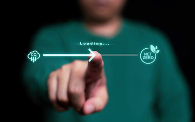 Businessman hand touching to slide loading bar to reduce carbon  to net zero emission for decrease...
