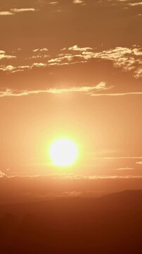 Brilliant Golden Sunrise with Clodus Timelapse Vertical Video