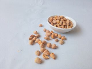 baked beans on a white plate isolate on white