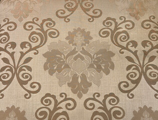 European baroque classic pattern carved and sewn on a golden fabric. Seamless classic ornaments and...