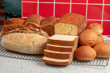 Side view on variety of fresh bread loaves