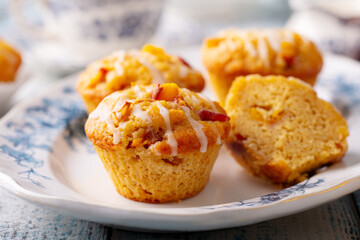 Peach muffins, cupcakes on a plate. Close up.