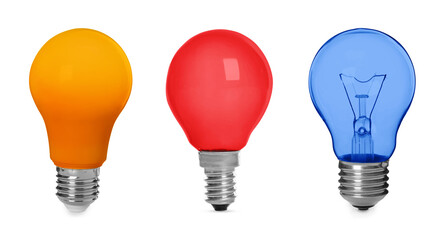 Different light bulbs with colorful glass on white background, set