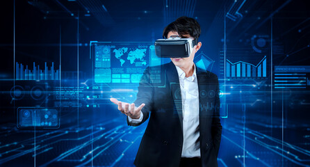 Smart business man connecting at global network by using VR glasses. Project manager accessing big data by using artificial intelligence analyzing business data and show financial chart. Ingenuity.