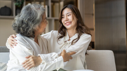 Fototapeta premium Portrait of enjoy happy love asian family senior mature mother and young daughter smiling play laughing and having fun together at home, care, elderly, insurance.happy family and Mother Day concept