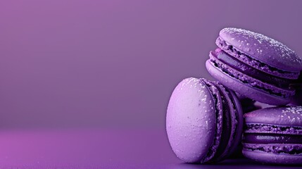 Obraz premium Purple macarons on a purple background.