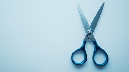A pair of scissors with blue handles on a light blue background, symbolizing precision, cutting, and crafting. Perfect for office or school use.