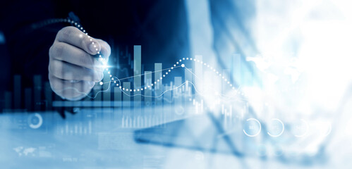 Business growth graph chart. Businessman using tablet analyzing sales data and financial report.Financial marketing graph grow chart. Arrow up with graph corporate future growth plan.