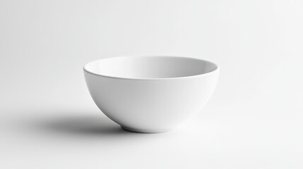 Minimalist white ceramic bowl on a light background, showcasing simplicity and elegance in modern kitchenware design.