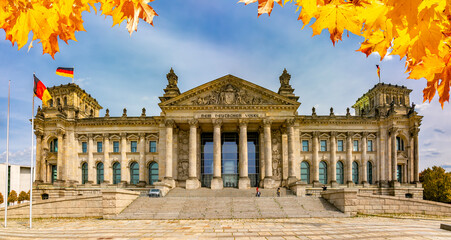 Reichstag - parliament building in autumn, Berlin, Germany (inscription "for German people") © Mistervlad