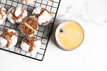 chocolate coffee cookies with cracks and coffee