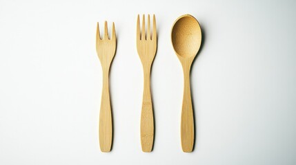 A biodegradable fork and spoon set, laid side by side on a white background, highlighting eco-conscious packaging.