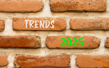Planning trends 2025 new year symbol. Concept words Trends 2025 on beautiful brown brick wall. Beautiful brown brick wall background. Business trends 2025 new year concept. Copy space.
