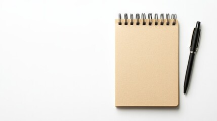 Top view of blank spiral notepad with pen on white background, perfect for notes, planning, and recording ideas in minimalistic style.