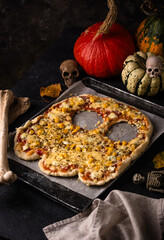 Halloween scary pizza in shape of ghost