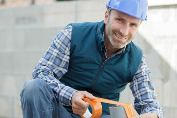 happy man with tape measure