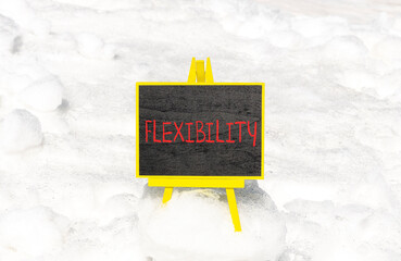 Flexibility symbol. Concept word Flexibility on beautiful chalk blackboard. Beautiful white snow...