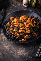 Halloween dish black pasta with bolognese