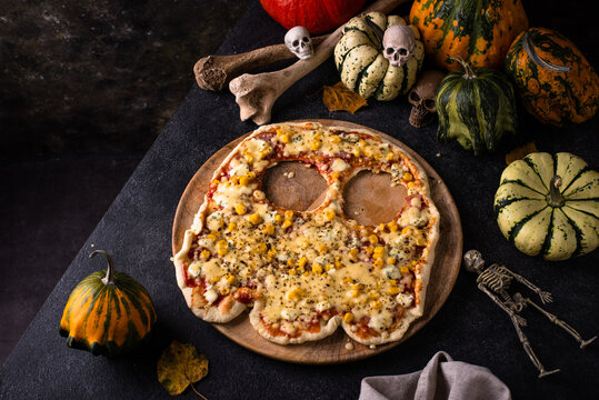Halloween scary pizza in shape of ghost