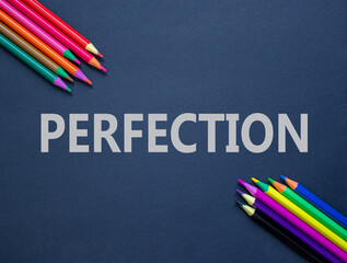Perfection symbol. Concept word Perfection on beautiful black paper. Beautiful black paper background. Colored pencils. Business perfection concept. Copy space.