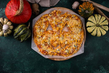 Halloween scary pizza in shape of pumpkin