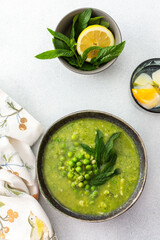 Creamy broccoli and green pea soup with mint, delicious healthy lunch