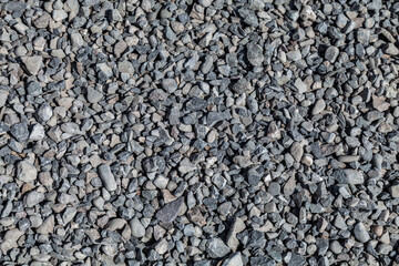construction rubble on the road as a background, stone texture