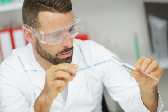 male researcher carrying out scientific research