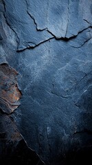  A tight shot of a rock face exhibiting a central crevice, encrusted with rust