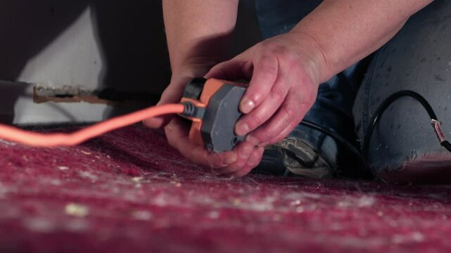 Plugging in electric power extension cable 