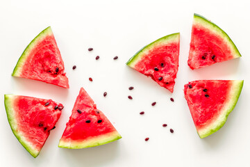 Slices of watermelon on white background top view