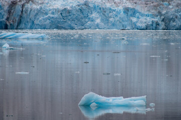 Glacier Blue wall of ice with reflections cascading below.