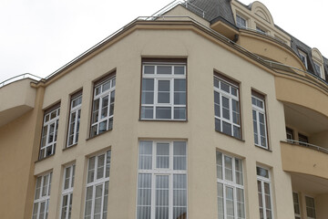 A very large and expansive building with a significant number of windows on its exterior facade, creating a stunning visual effect