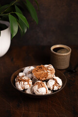 chocolate coffee cookies with cracks and coffee