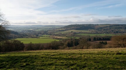 Fototapeta premium Serene valley landscape under a bright sky in the early morning light