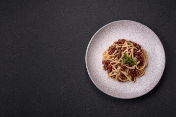 Rice noodles with beans, meat, tomato sauce, spices and herbs