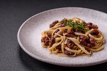 Rice noodles with beans, meat, tomato sauce, spices and herbs