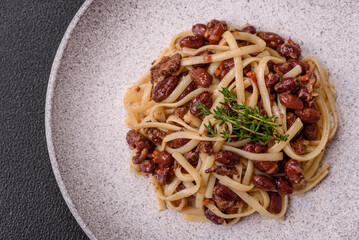 Rice noodles with beans, meat, tomato sauce, spices and herbs