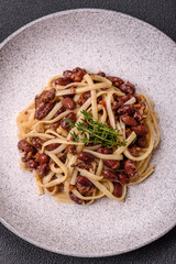 Rice noodles with beans, meat, tomato sauce, spices and herbs