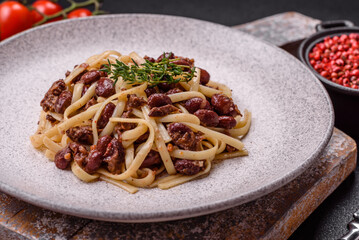 Rice noodles with beans, meat, tomato sauce, spices and herbs