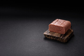 Delicious canned pink spiced ham or spam with salt, spices and herbs