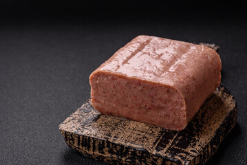 Delicious canned pink spiced ham or spam with salt, spices and herbs